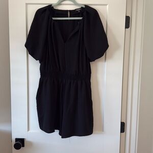 Boutique romper never worn still has string where tag was. Dress up or down